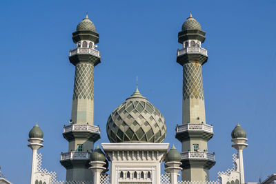 Low angle view of building against blue sky