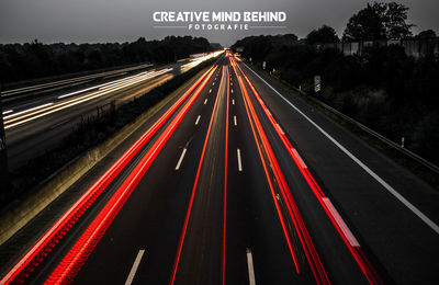 High angle view of light trails on highway