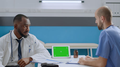 Doctor examining patient in clinic