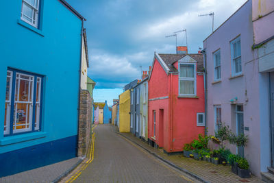 Street amidst buildings against sky