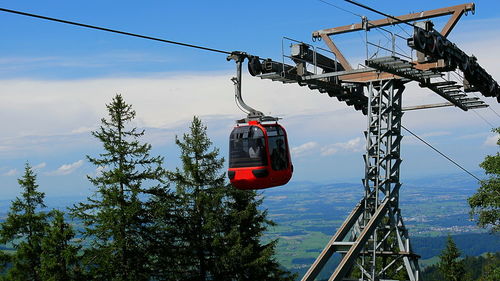 Low angle view of ski lift against sky