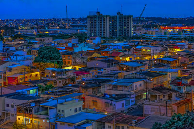 Aerial view of illuminated cityscape against clear sky