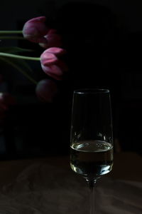 Midsection of woman holding glass