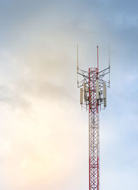 Antenna tower telecommunications tower in the afternoon bright sunlight and cloudy blue sky