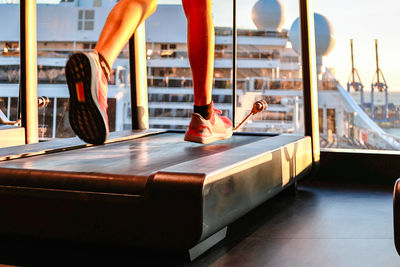 Low section of woman exercising in gym