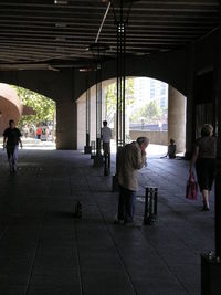 Full length of woman standing by railing