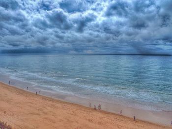 Scenic view of sea against cloudy sky