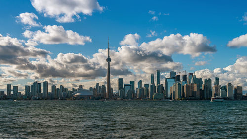 View of skyscrapers against cloudy sky