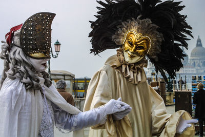 People wearing masks and costumes during carnival