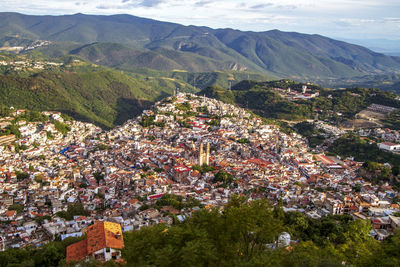 High angle view of townscape and mountains