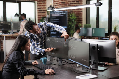 Business colleagues brainstorming at office