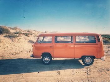 Vintage car on land against clear sky