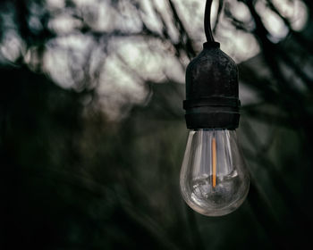 Close-up of illuminated light bulb