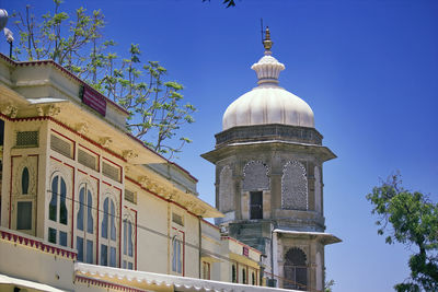 Low angle view of building against blue sky