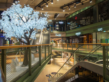 View of shopping mall in city at night