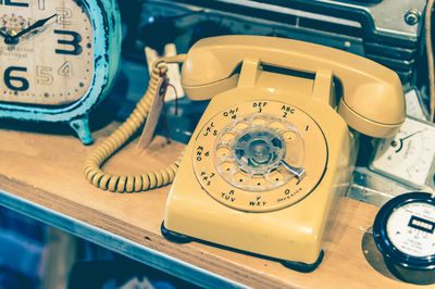 High angle view of old telephone on table