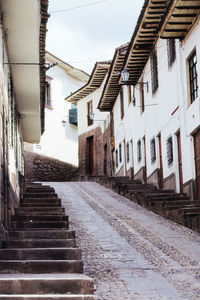 Narrow alley amidst buildings in city