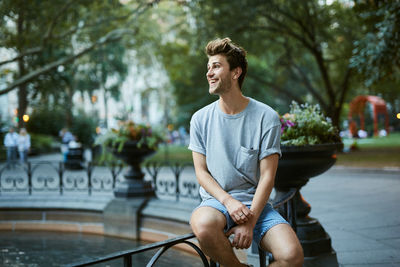 Young man sitting on bicycle