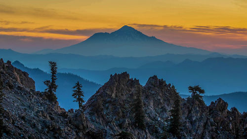 Panoramic view of mountains against sky during sunset