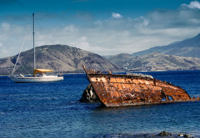 Sailboat on sea against sky