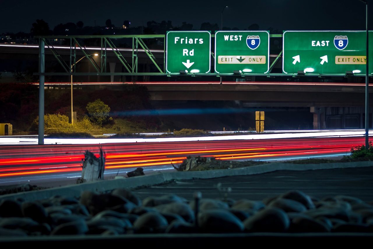 LIGHT TRAILS ON RAILROAD STATION AT NIGHT