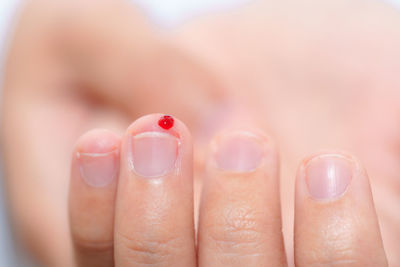 Close-up of blood on finger