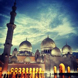 Low angle view of mosque against blue sky