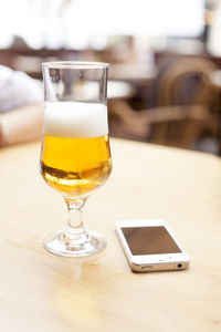 Close-up of beer glass on table