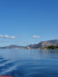 Scenic view of sea against blue sky