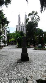 Statue in temple against sky