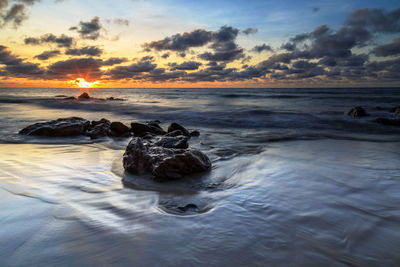Scenic view of sea against sky during sunset