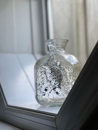 Mercury glass vase in window