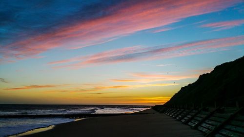 Scenic view of sea against sky at sunset