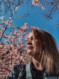 Portrait of beautiful young woman in park