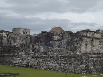 Old ruin building against cloudy sky