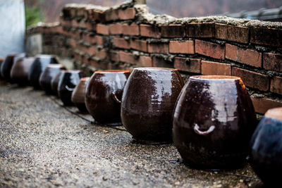 Close-up of abandoned objects against wall