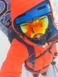 Close-up of person with umbrella in snow
