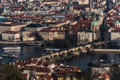 High angle view of bridge over river and buildings in city