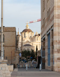 Buildings in city against sky