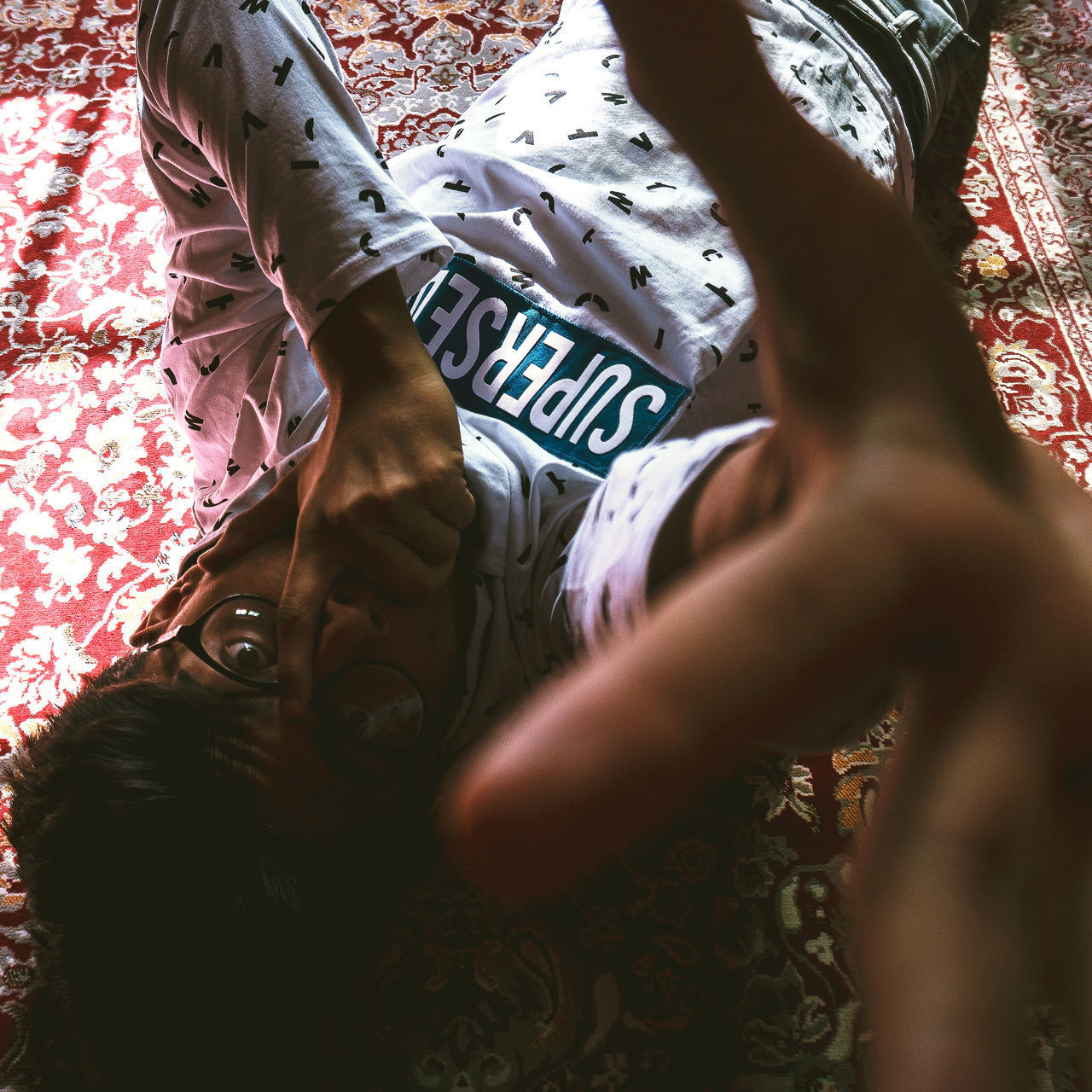 HIGH ANGLE VIEW OF WOMAN LYING DOWN ON BED
