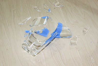 High angle view of broken glass on table