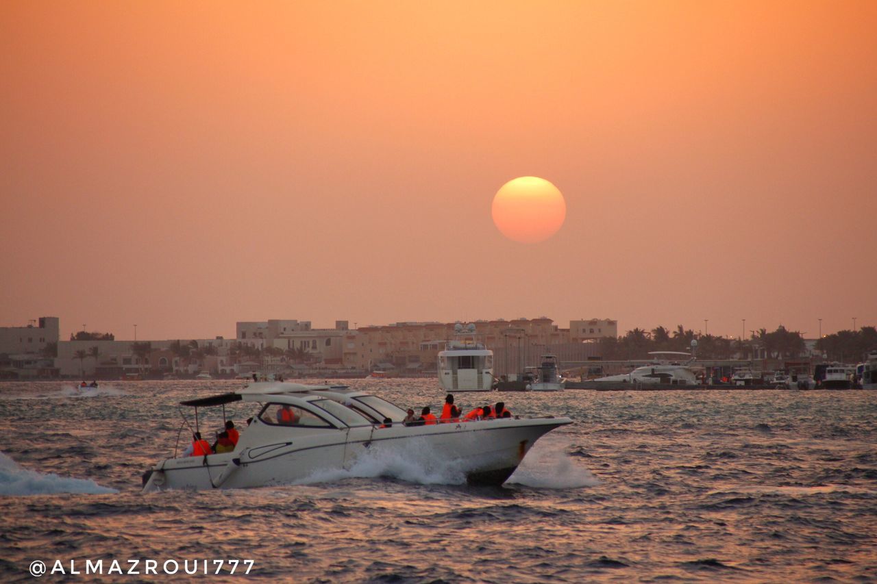 sunset, nautical vessel, transportation, mode of transport, built structure, architecture, sky, water, nature, moon, sea, sun, outdoors, building exterior, no people, beauty in nature, clear sky, city, day