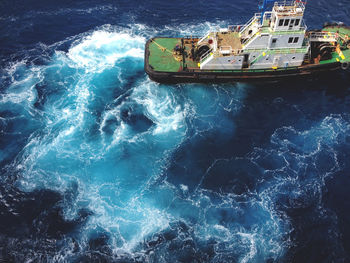 High angle view of ship sailing in sea