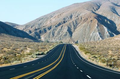 Panoramic view of road amidst mountains against sky
