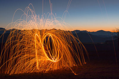 Light trails against sky at night