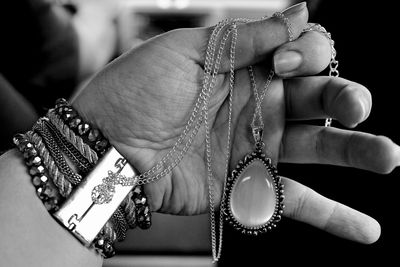 Close-up of woman holding jewelry 