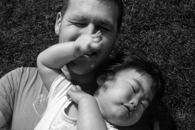 Happy father with daughter on field