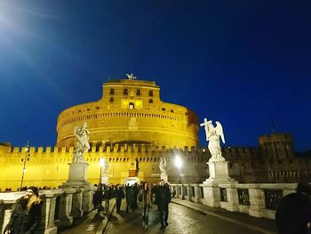 Low angle view of historical building at night