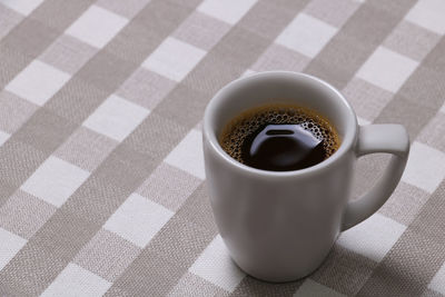 High angle view of coffee cup on table