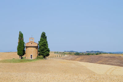 Built structure on field against clear sky